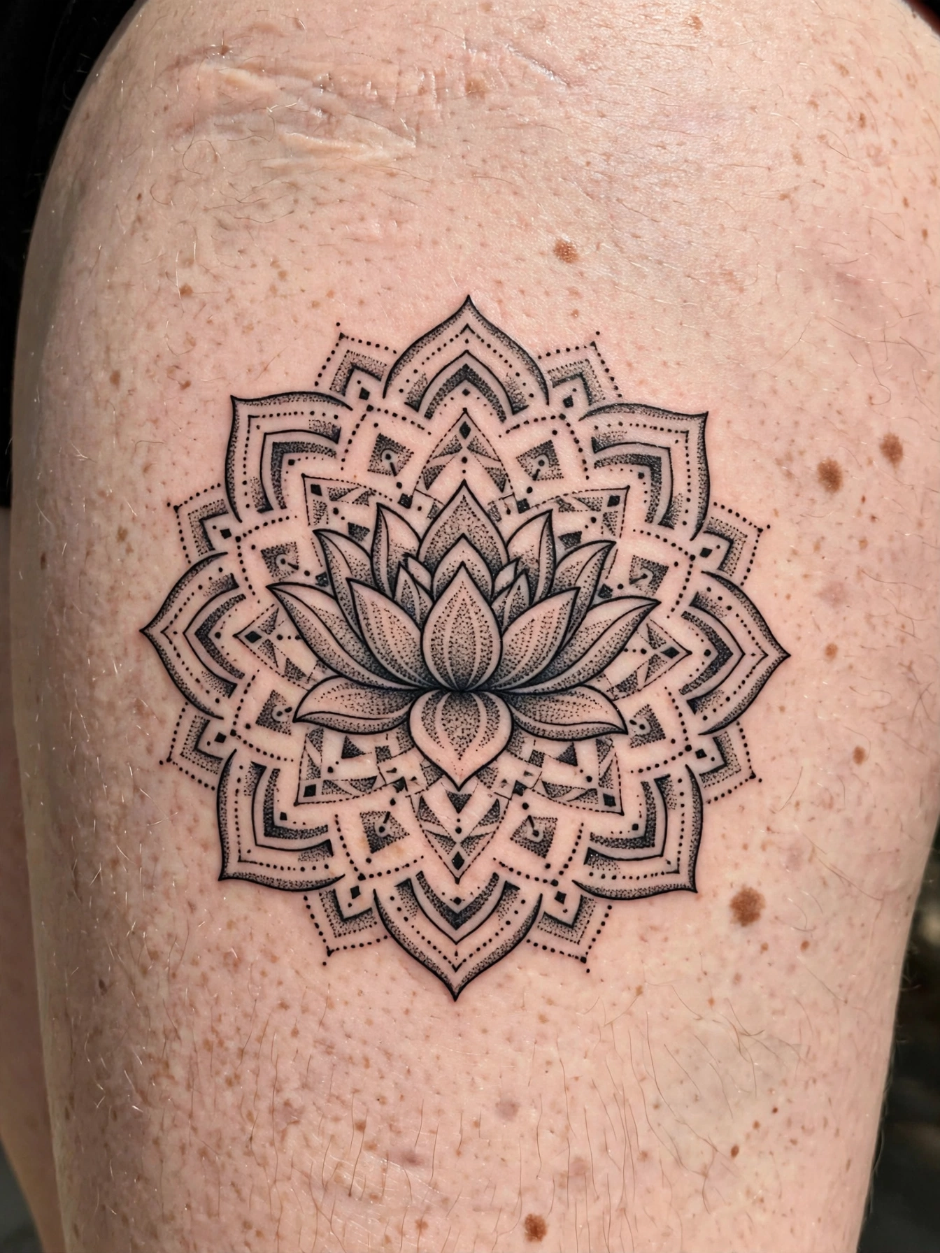 Lotus mandala tattoo on a thigh